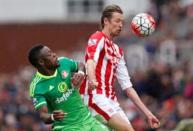 Britain Football Soccer - Stoke City v Sunderland - Barclays Premier League - The Britannia Stadium - 30/4/16 Sunderland's Lamine Kone in action with Stoke's Peter Crouch Action Images via Reuters / Carl Recine Livepic