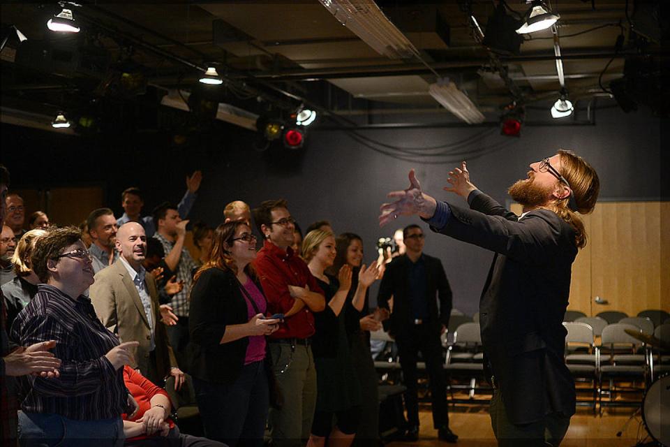 British comedian Sanderson Jones leads a Sunday Assembly meeting in 2013 in Washington, D.C. <a href="https://www.gettyimages.com/detail/news-photo/british-comedian-sanderson-jones-leads-the-sunday-assembly-news-photo/452045207?adppopup=true" rel="nofollow noopener" target="_blank" data-ylk="slk:Astrid Riecken for The Washington Post via Getty Images;elm:context_link;itc:0;sec:content-canvas" class="link ">Astrid Riecken for The Washington Post via Getty Images</a>