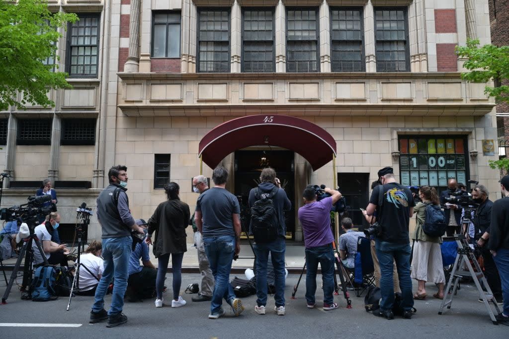 Members of the media gathered outside the apartment building where Rudy Giuliani lives on New York’s Upper East Side (AFP via Getty Images)