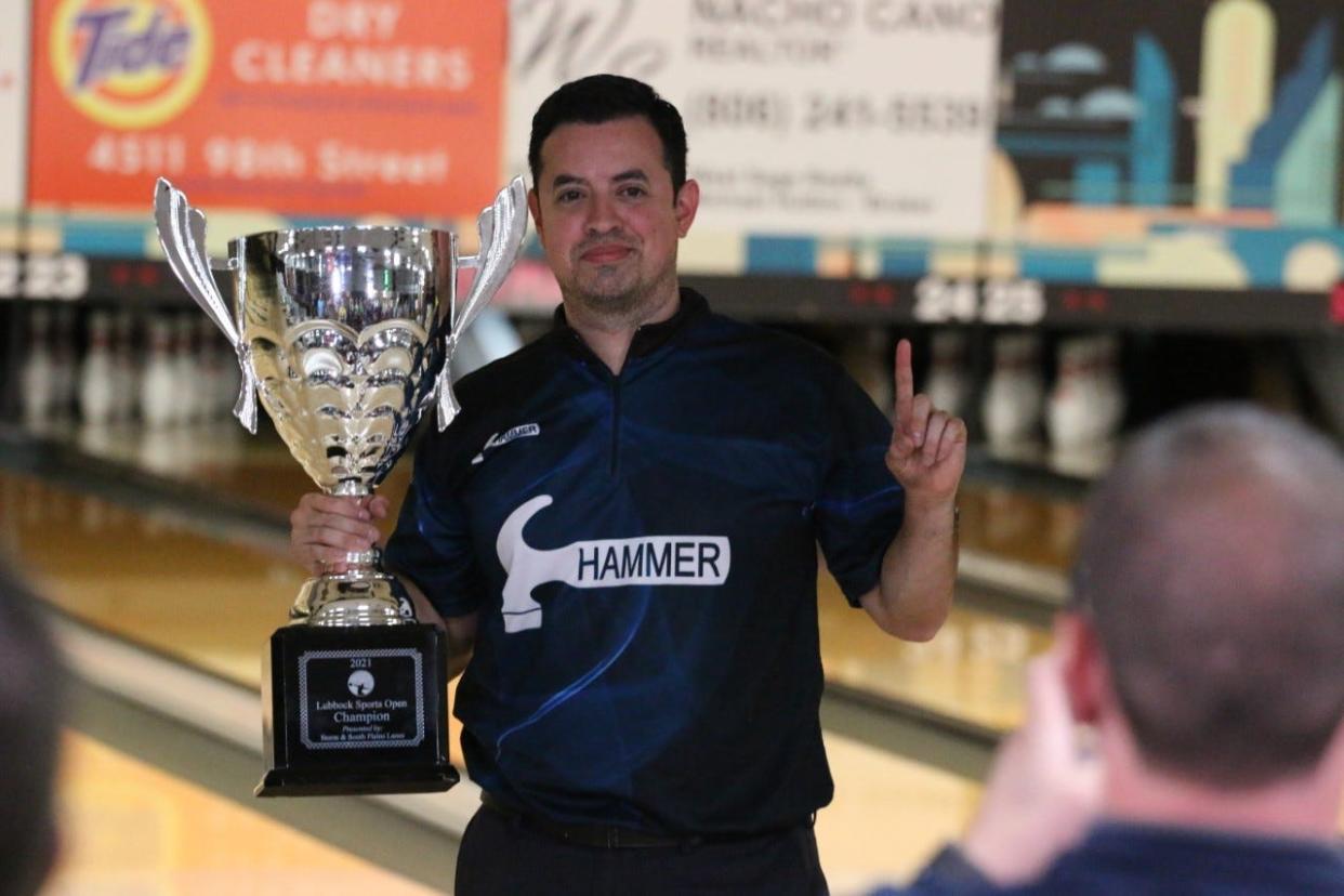 Houston bowler Shawn Maldonado poses with the trophy cup after winning the PBA Lubbock Sports Open on Sunday at South Plains Lanes. It was the second career PBA Tour national title for Maldonado.