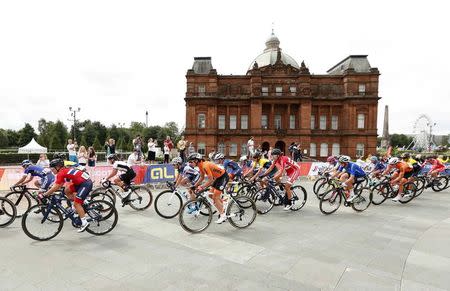 2018 European Championships - Road Cycling, Road Race Women - Glasgow, Britain - August 5, 2018 - Cyclists ride past People’s Palace in Glasgow Green. REUTERS/Peter Cziborra