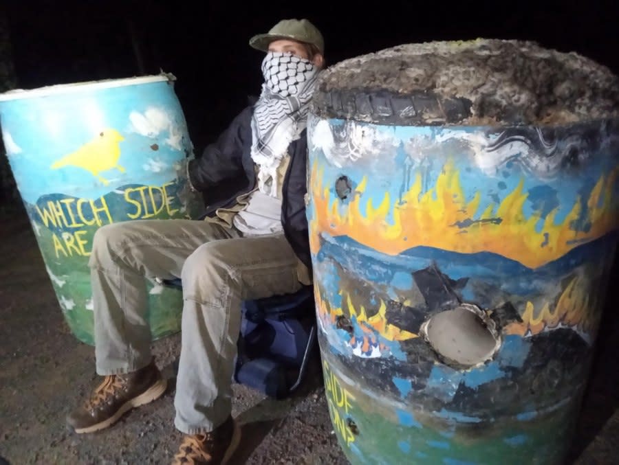Mountain Valley Pipeline protester locked to two barrels on Honeysuckle Road on May 16. (Photo Courtesy: Appalachians Against Pipelines)