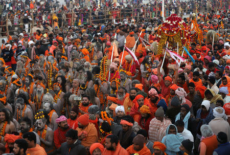 Sadhus or Hindu holy men leave after taking a dip during the first "Shahi Snan" (grand bath) at "Kumbh Mela" or the Pitcher Festival, in Prayagraj, previously known as Allahabad, India, January 15, 2019. REUTERS/Jitendra Prakash