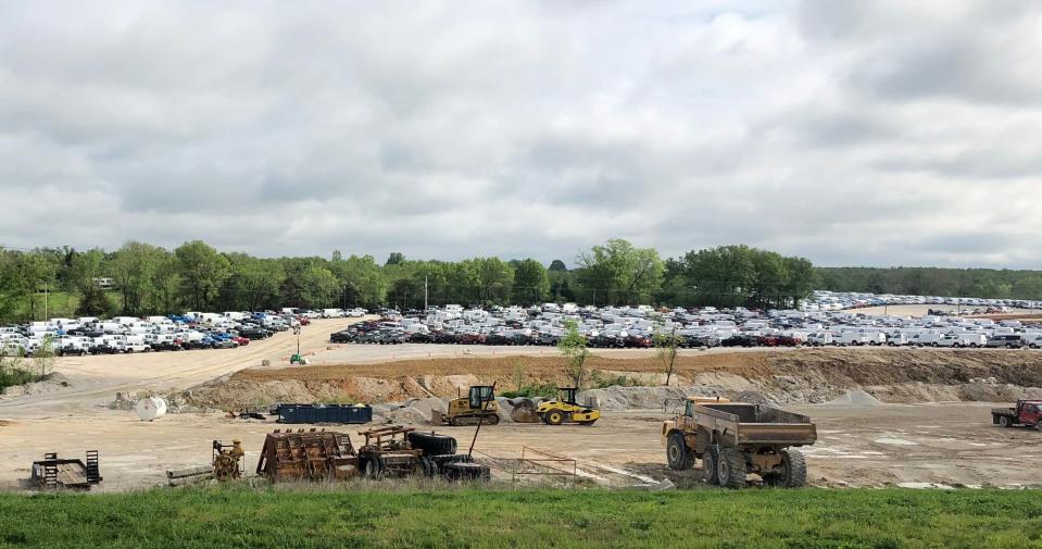 At Bedrock Quarry in Troy, Missouri. General Motors is storing several hundred Chevrolet Colorado and GMC Canyon midsize pickups and full-size vans while they await parts to complete production at Wentzville Assembly plant in Missouri. Then they will ship to dealerships.  The industry is faced with a massive shortage of semiconductor chips used in car parts causing automakers to build and store vehicles in certain instances.