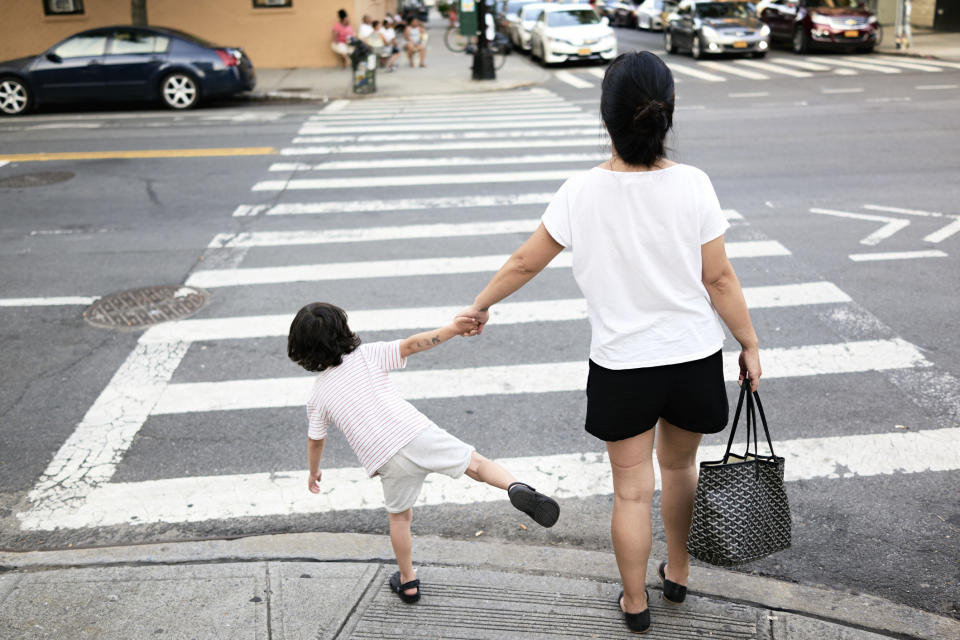 A parent walking with their child