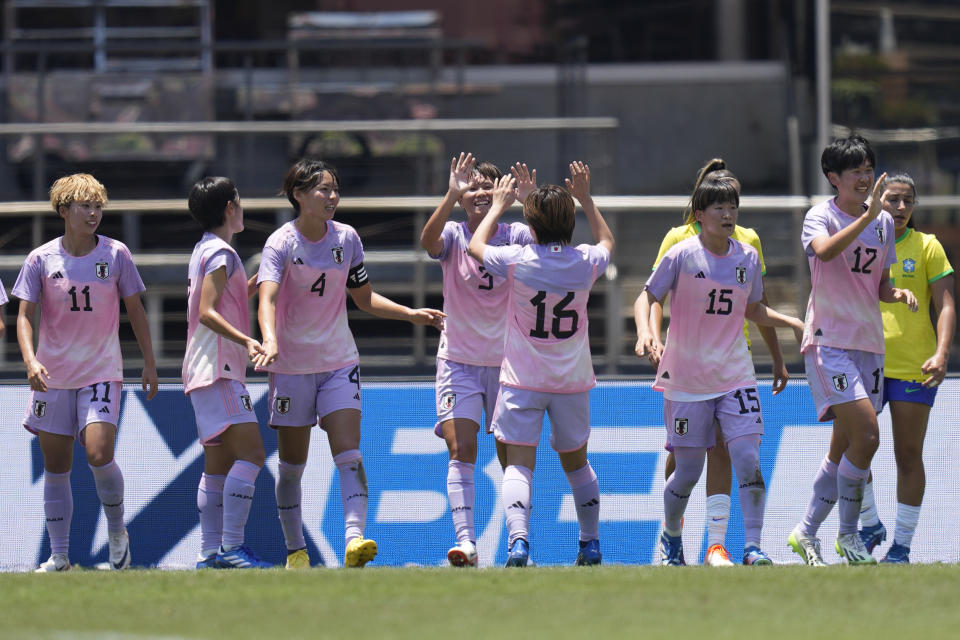 Players of Japan celebrate their side's opening goal against Brazil, scored by teammate Meek Minami during a women's friendly soccer match at Morumbi stadium in Sao Paulo, Brazil, Sunday, Dec. 3, 2023. (AP Photo/Andre Penner)