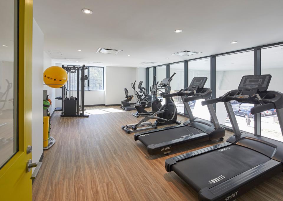 A gym is just one of many amenities for residents in the building.