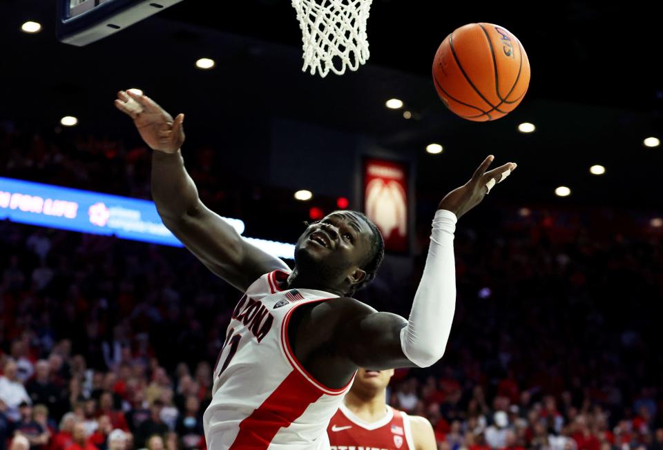 Arizona center Oumar Ballo (11) goes for a rebound against Stanford during a February game at McKale Center in Tucson, Ariz.