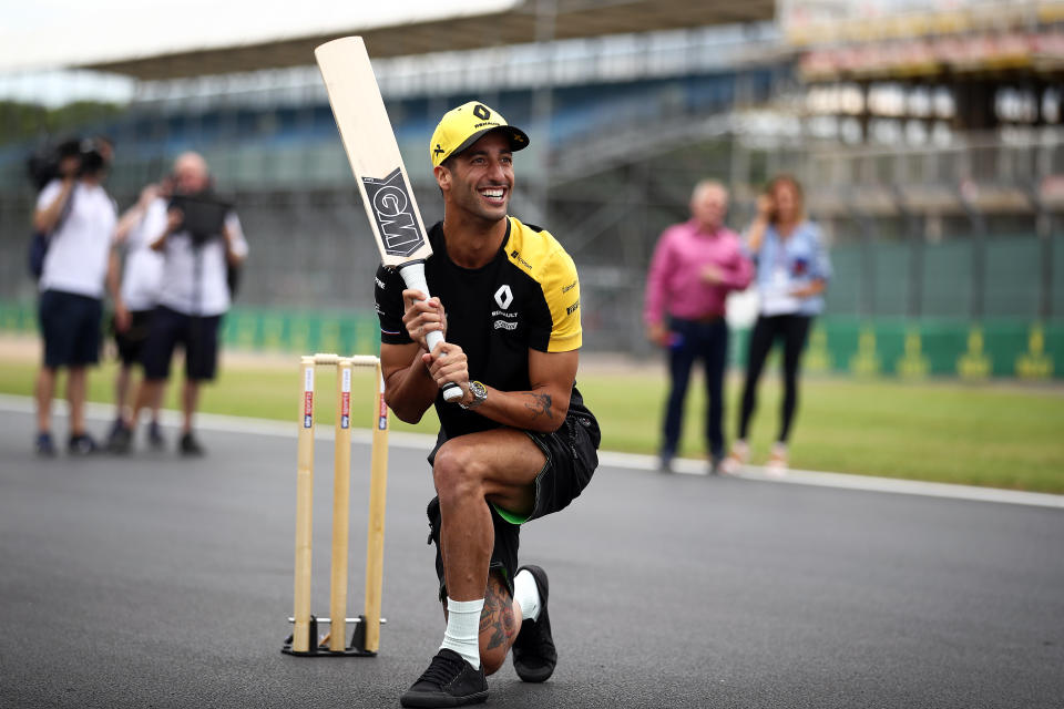 NORTHAMPTON, ENGLAND - JULY 11: Daniel Ricciardo of Australia and Renault Sport F1 plays cricket on track during previews ahead of the F1 Grand Prix of Great Britain at Silverstone on July 11, 2019 in Northampton, England. (Photo by Bryn Lennon/Getty Images)