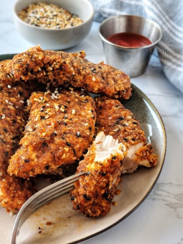 <p>These gluten-free, keto, paleo and whole30 everything bagel chicken tenders are about to rock your world! These crisp, juicy and“everything bagel” seasoned chicken tenders will surely become a weeknight family favorite!</p><p><strong>Get the recipe: <a href="https://paleoishkrista.com/gluten-free-everything-bagel-chicken-tenders/" rel="nofollow noopener" target="_blank" data-ylk="slk:Gluten-Free Everything Chicken Tenders;elm:context_link;itc:0;sec:content-canvas" class="link rapid-noclick-resp">Gluten-Free Everything Chicken Tenders</a></strong></p>