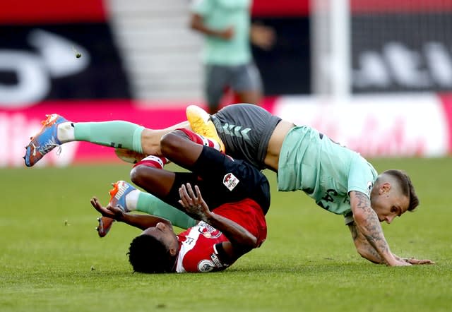 Lucas Digne (top) was dismissed for his tackle on Kyle Walker-Peters.