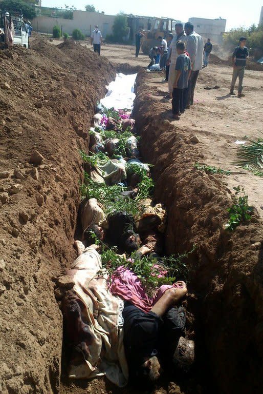 A handout picture of bodies in a mass grave in Daraya of people said to have been killed by regime forces. Fighting took place on Friday in Daraya, which President Bashar al-Assad's forces have been trying to retake for weeks, a watchdog says