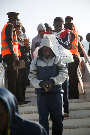 Gambian migrants deported from Libya arrive at the airport in Banjul, Gambia April 4, 2017. REUTERS/Luc Gnago