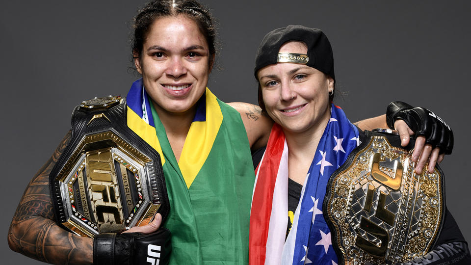 Amanda Nunes and Nina Ansaroff, pictured here with Nunes' championship belts.