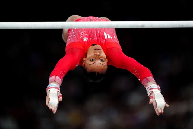 Becky Downie competing on the uneven bars