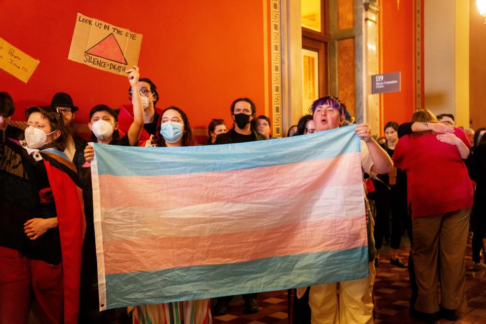 Protesters stand outside the chamber doors as they shout in opposition to HSB 649 Tuesday, Feb. 6, 2024, at the Iowa State Capitol. The bill would set legal definitions for the words, "sex," "man" and "women" into state law.
