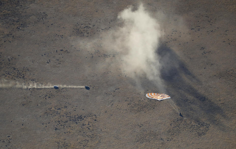 Rescue vehicles approach to the Russian Soyuz MS-12 space capsule landing about 150 km (90 miles) south-east of the Kazakh town of Zhezkazgan, Kazakhstan, Thursday, Oct. 3, 2019. A Soyuz space capsule with U.S. astronaut Nick Hague, Russian cosmonaut Alexey Ovchinin and United Arab Emirates astronaut Hazzaa Ali Almansoori, returning from a mission to the International Space Station landed safely on Thursday on the steppes of Kazakhstan. (AP Photo/Dmitri Lovetsky, Pool)