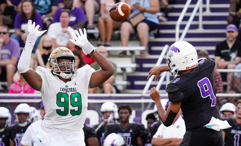 Cathedral Fighting Irish Kendrick Gilbert (99) attempts to block a pass from Brownsburg Bulldogs quarterback Jayden Whitaker (9) on Friday, August 27, 2021, at Brownsburg High School, Brownsburg. Cathedral Fighting Irish defeated Brownsburg Bulldogs, 20-7. 