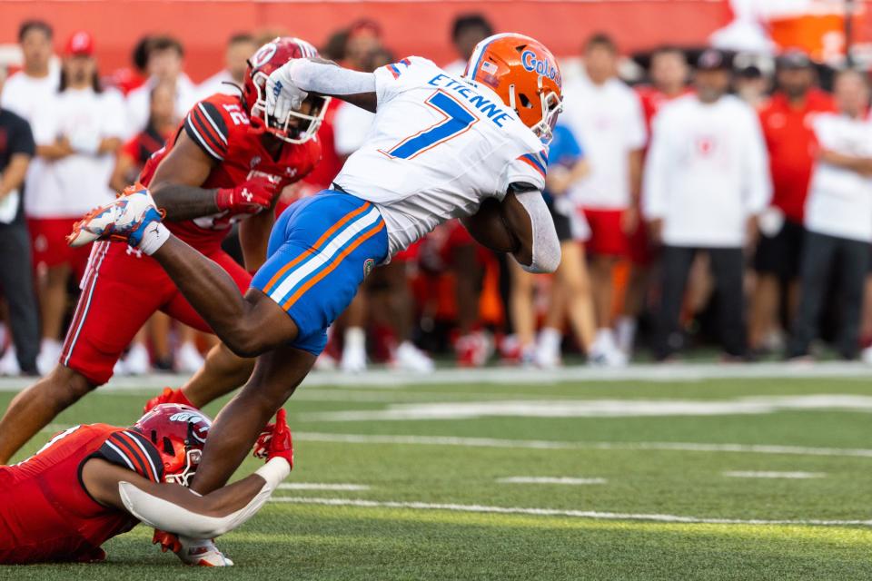 Florida Gators running back Trevor Etienne (7) runs the ball during Utah’s season opener at Rice-Eccles Stadium in Salt Lake City on Thursday, Aug. 31, 2023. | Megan Nielsen, Deseret News