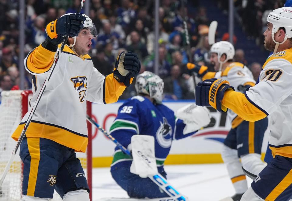 Nashville Predators' Luke Evangelista, left, and Ryan O'Reilly celebrate O'Reilly's goal against the Vancouver Canucks during the second period in Game 1 of an NHL hockey Stanley Cup first-round playoff series, in Vancouver, on Sunday, April 21, 2024.