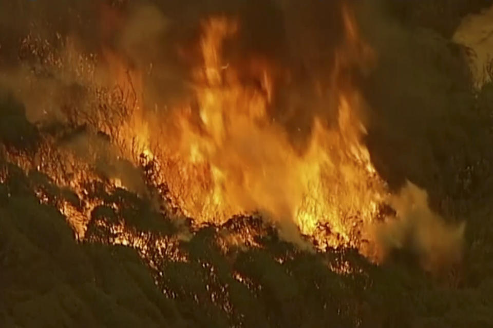 In this image made from video, an aerial scene shows fires burning in East Grippsland, Victoria state, Tuesday, Dec. 31, 2019. Wildfires burning across Australia's two most-populous states Tuesday trapped residents of a seaside town in apocalyptic conditions, destroyed many properties. (Australian Broadcasting Corporation, Channel 7, Channel 9 via AP)