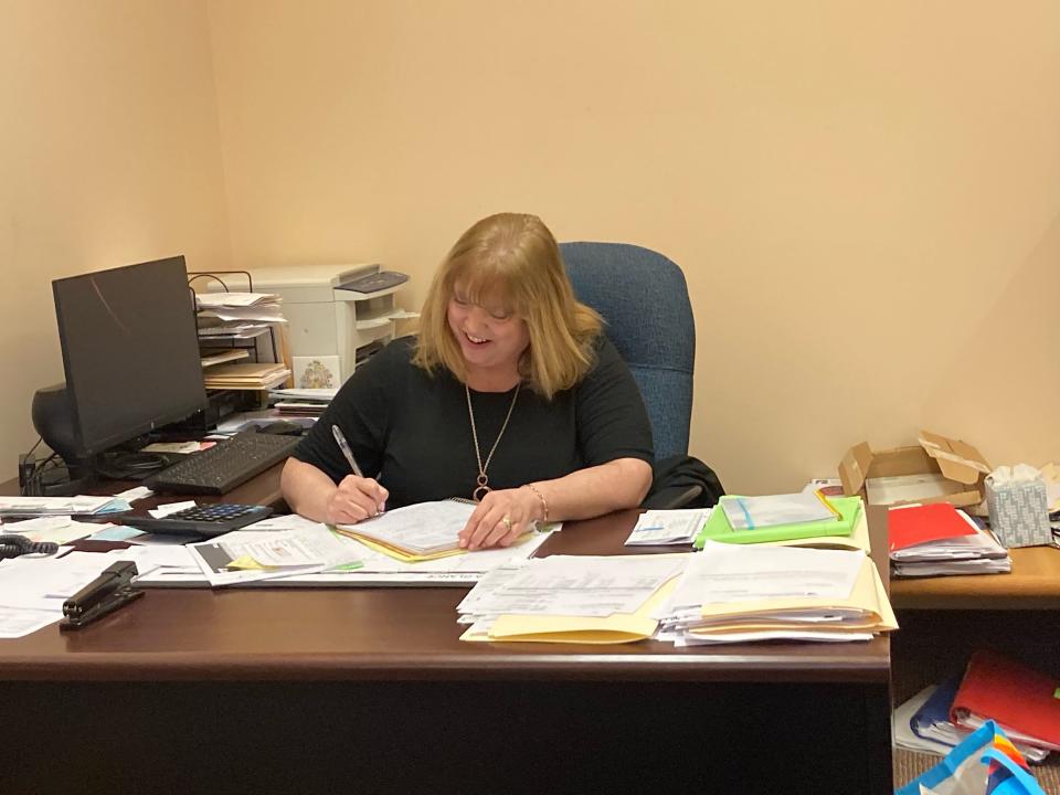 Heather Baker, new director of the Ellwood City Area Public Library, at work.