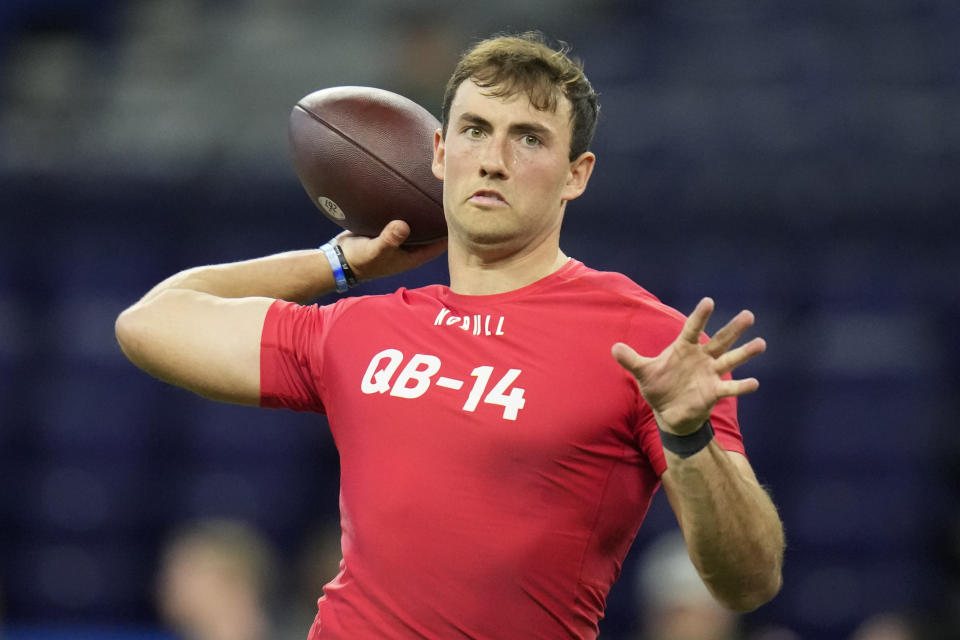 FILE - Houston quarterback Clayton Tune runs a drill at the NFL football scouting combine in Indianapolis, Saturday, March 4, 2023. Teams had shied away in recent years on taking a late-round flyer on quarterbacks as fewer teams kept three quarterbacks on the roster after the NFL eliminated the game-day roster exemption for an emergency third quarterback.(AP Photo/Michael Conroy, File)