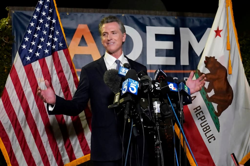 California Gov. Gavin Newsom addresses reporters after beating back the recall attempt that aimed to remove him from office, at the John L. Burton California Democratic Party headquarters in Sacramento, Calif., Tuesday, Sept. 14, 2021. (AP Photo/Rich Pedroncelli)