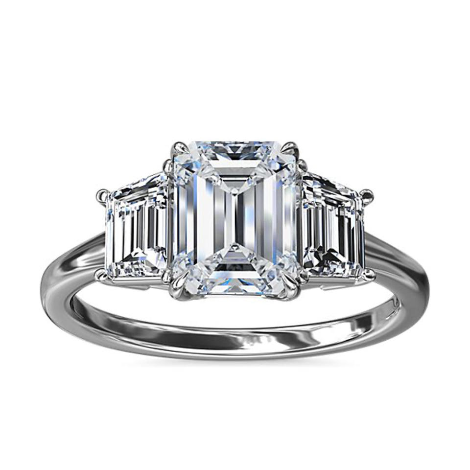 Blue Nile Three-Stone Trapezoid Sidestone Diamond Engagement Ring In Platinum on white background