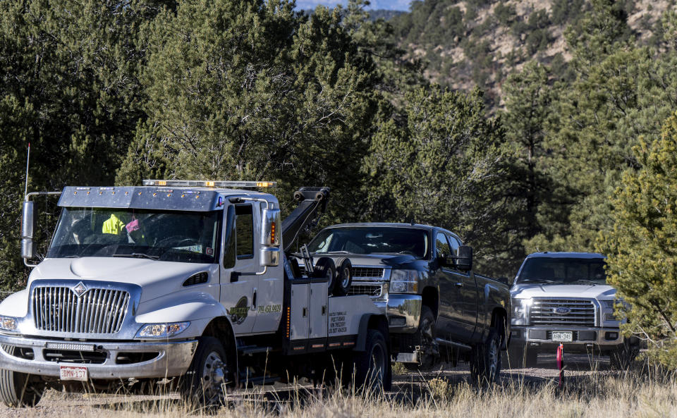 A truck with bullet holes in the windshield and a shattered window is towed from the scene of a fatal shooting on Tuesday, Nov. 21, 2023 near Westcliffe, Colo. Authorities say they have captured the man accused of fatally shooting a few people over a years-long property dispute in rural Colorado. The Custer County Sheriff’s Office announced Tuesday afternoon that Hanme K. Clark was arrested by New Mexico State police. (Parker Seibold/The Gazette via AP)