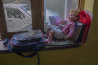 A school bag lies next to a doll belonging to a young Kashmiri student inside her home in Srinagar, Indian controlled Kashmir, Thursday, July 18, 2020. Decades of insurgency, protests and military crackdowns have constantly disrupted formal schooling in Indian-administered Kashmir, where rebels have fought for decades for independence or unification with Pakistan, which controls the other part of the Muslim-majority region. A generation of students have seen their education upended, and empty classrooms are a familiar sight. Now, the coronavirus lockdown is amplifying the problem. (AP Photo/Dar Yasin)