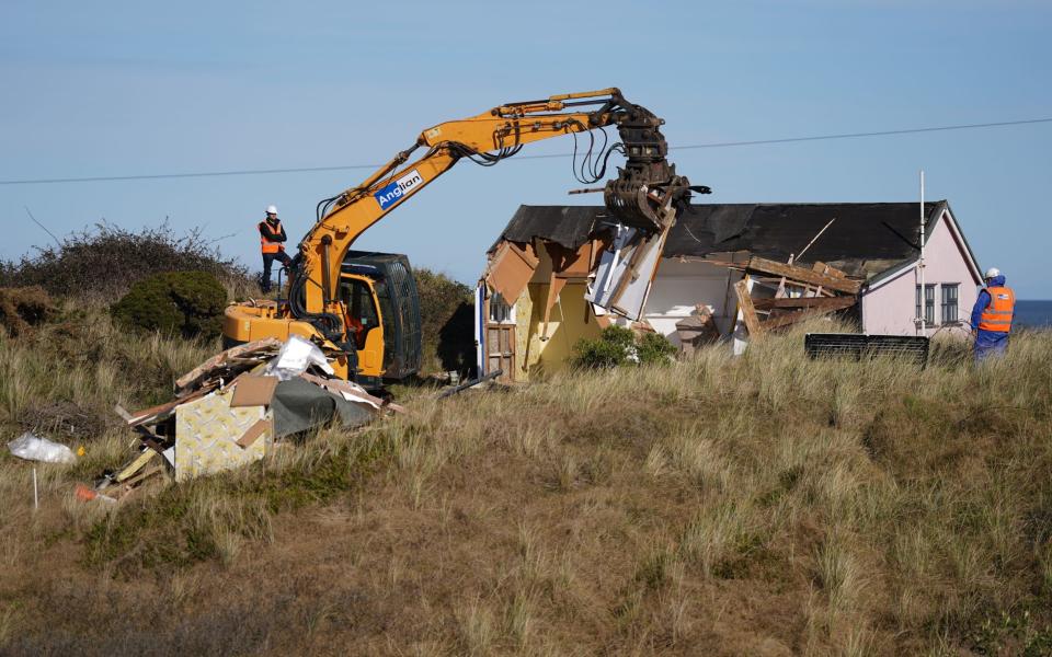 Sue's house, which is at risk of collapsing, being demolished - Joe Giddens/PA Wire