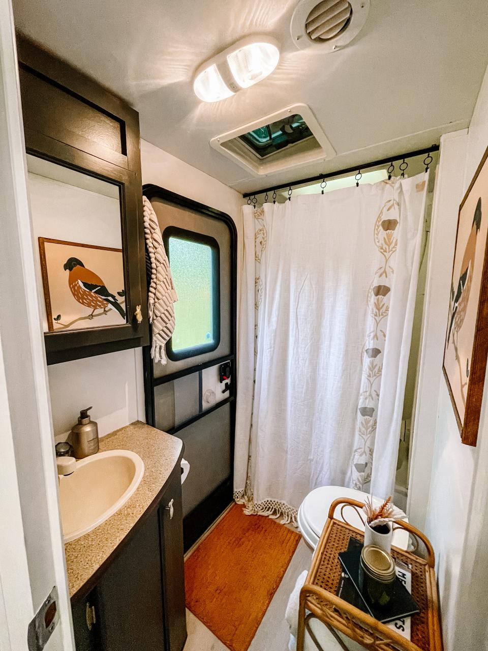 The bathroom is surprisingly spacious in this 2014 camper. Owner Kat Chandler painted a portrait of a finch as a tribute to the camper’s name. Fountain City, April 14.