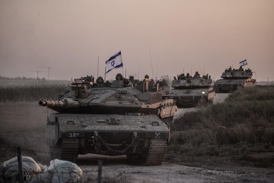 Israeli tanks move near Gaza border as Israeli army deploys military vehicles around the Gaza Strip, Israel on October 12, 2023.