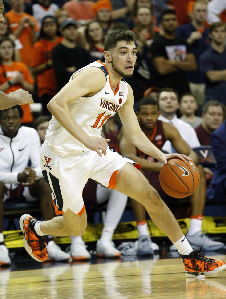 FILE - In this Jan. 15, 2019, file photo, Virginia guard Ty Jerome (11) drives to the basket during the first half of an NCAA college basketball game against Virginia Tech, in Charlottesville, Va. Jerome was named to the AP All-ACC team, Tuesday, March 12, 2019. (AP Photo/Steve Helber, File)