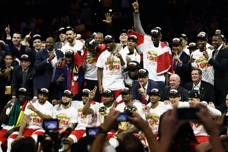 The Toronto Raptors celebrate with the Larry O'Brien Championship Trophy after their team defeated the Golden State Warriors to win Game Six of the 2019 NBA Finals at ORACLE Arena on June 13, 2019 in Oakland, California. (Photo by Ezra Shaw/Getty Images)