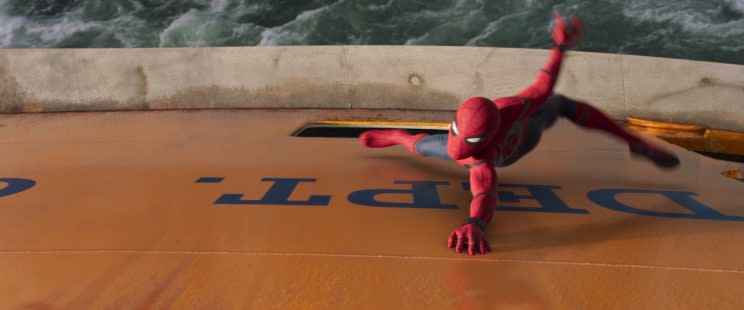 Spider-Man grabs on to the Staten Island Ferry in a last ditch effort to save it from sinking in 