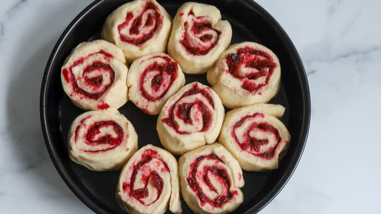 uncooked cinnamon rolls in pan