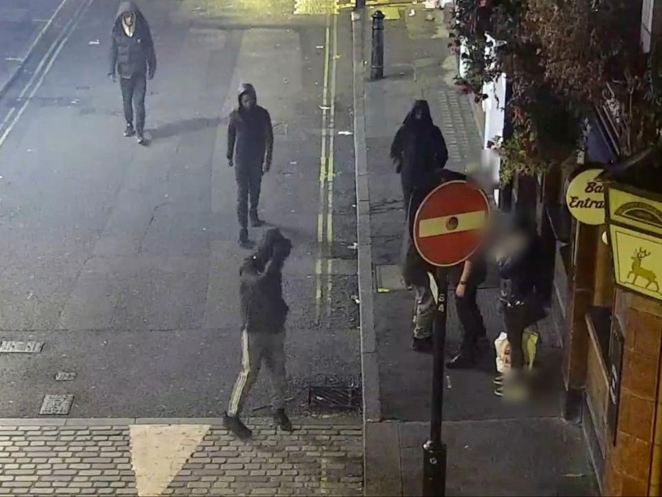 CCTV of an undercover officer wearing a luxury watch being followed by four thieves with their hoods up in London’s West End in October 2022. (Met Police)