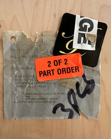 <p>Lucille Damone</p> Dry cleaners tag found on wedding coat