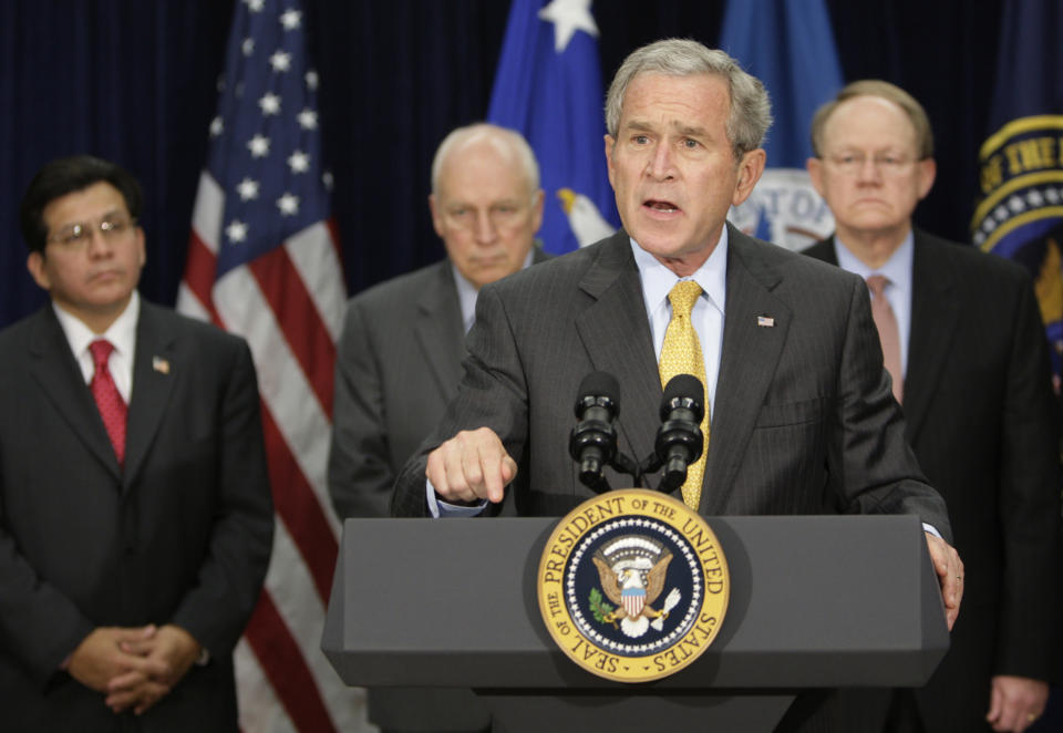 President Bush makes comments after meeting with the Counterterrorism Team at the J. Edgar Hoover FBI Building in Washington in 2007. Behind the president, from left are, Attorney General Alberto Gonzales, Vice President Dick Cheney, Admiral Mike McConnell, director of National Intelligence. (Photo: Ron Edmonds/AP)