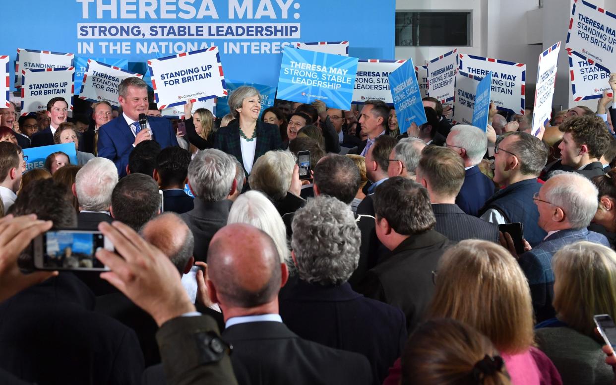 In Leeds on April 27 Conservative signs promote the values of Theresa May... - AFP and licensors