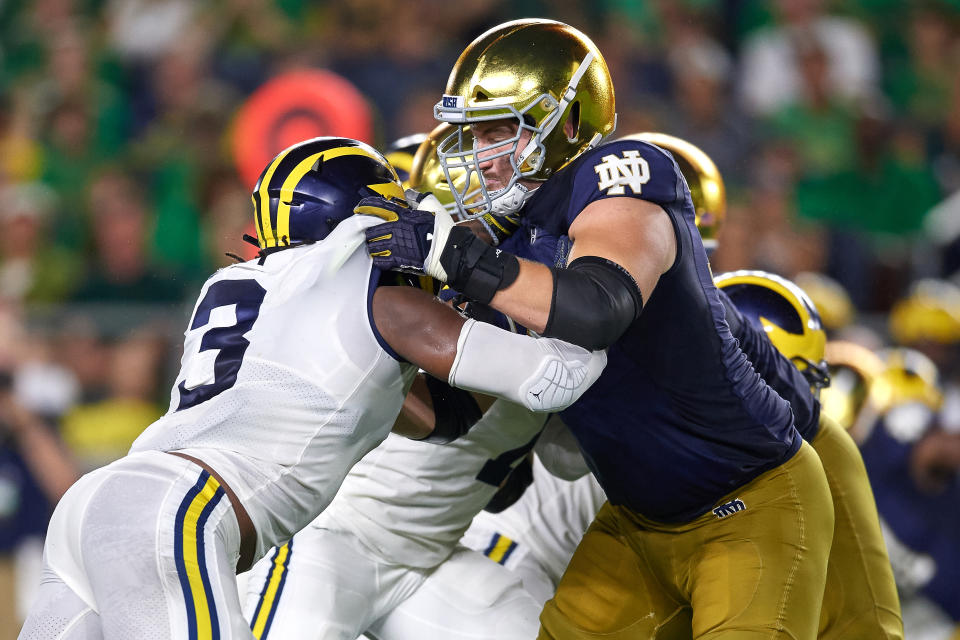 SOUTH BEND, IN - SEPTEMBER 01: Notre Dame Fighting Irish offensive lineman Liam Eichenberg (74) battles with Michigan Wolverines defensive lineman Rashan Gary (3) in game action during the college football game between the Michigan Wolverines and the Notre Dame Fighting Irish on September 1, 2018 at Notre Dame Stadium, in South Bend, Indiana. The Notre Dame Fighting Irish defeated the Michigan Wolverines by the score of 24-17. (Photo by Robin Alam/Icon Sportswire via Getty Images)