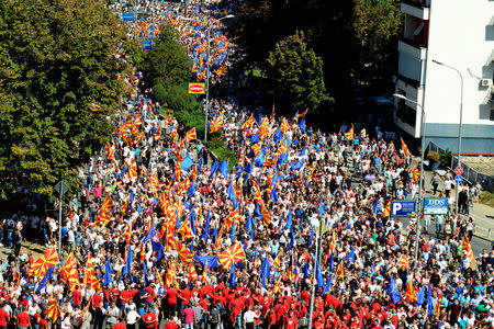 People wave flags during a march in support of a referendum on changing the country's name and its NATO and EU membership bids in Skopje, Macedonia September 16, 2018. REUTERS/Tomislav Georgiev