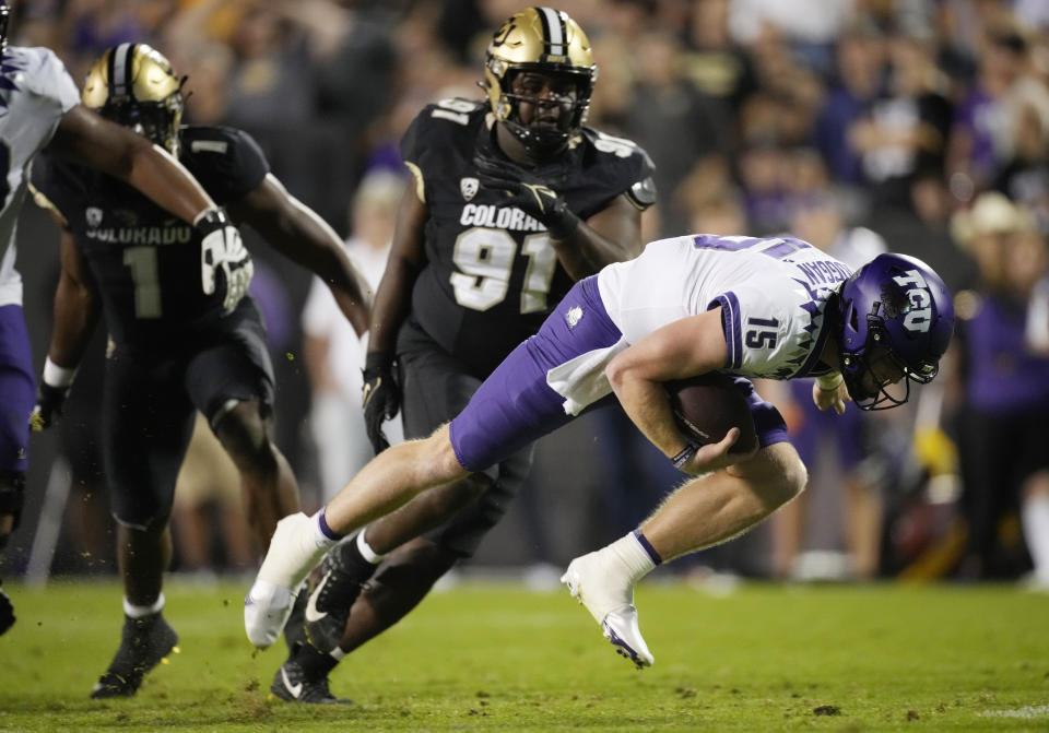 TCU quarterback Max Duggan runs for a short gain againsdt Colorado in the second half of an NCAA college football game Friday, Sept. 2, 2022, in Boulder, Colo. (AP Photo/David Zalubowski)