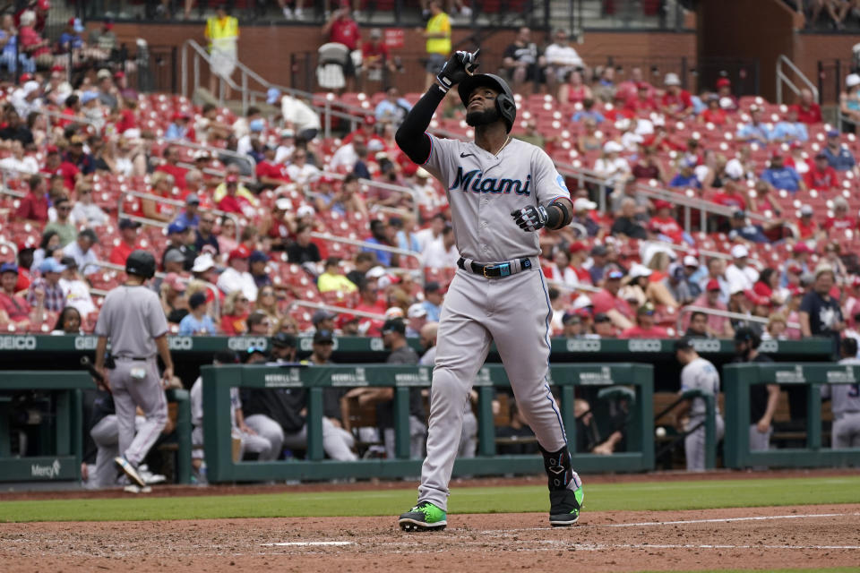 Miami Marlins' Bryan De La Cruz arrives home after hitting a solo home run during the eighth inning of a baseball game against the St. Louis Cardinals Wednesday, July 19, 2023, in St. Louis. (AP Photo/Jeff Roberson)