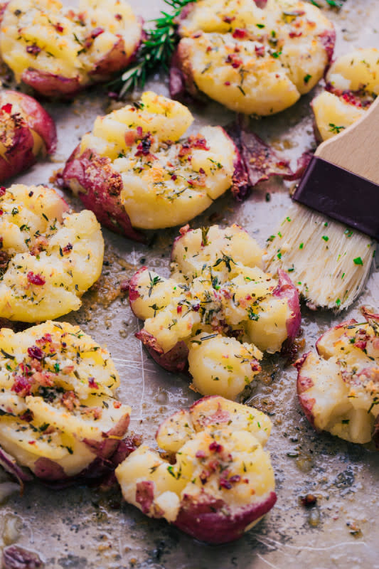<p>The Food Cafe</p><p>Herb garlic butter smashed potatoes have all the rich buttery goodness of a traditional mashed potato on the inside and are perfectly crisp and flavorful on the outside.</p><p><strong>Get the recipe: <a href="https://thefoodcafe.com/herb-garlic-butter-smashed-potatoes/" rel="nofollow noopener" target="_blank" data-ylk="slk:Herb Garlic Butter Smashed Red Potatoes;elm:context_link;itc:0;sec:content-canvas" class="link rapid-noclick-resp">Herb Garlic Butter Smashed Red Potatoes</a></strong></p>