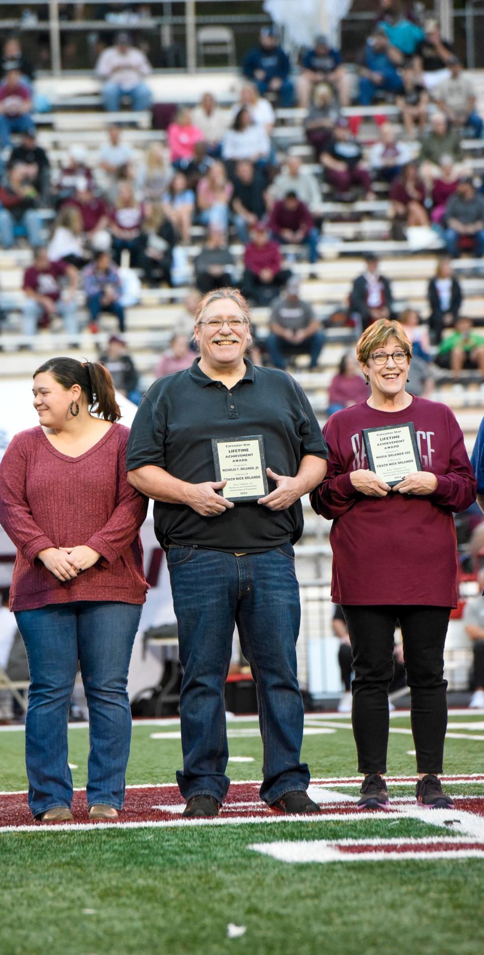 Among the family members accepting the award for the late Nick Orlando are Liz Orlando, Nicky Orlando and Maria Orlando Gee.