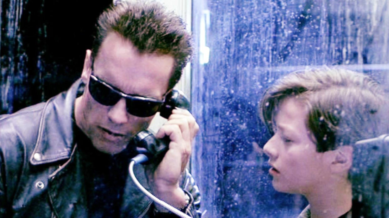  LOS ANGELES - JULY 3: The movie "Terminator 2: Judgment Day", (alt: T2) directed by James Cameron. Seen here from left, Arnold Schwarzenegger (as the Terminator, a T-800 Model) and Edward Furlong (as John Connor). They use a public payphone. Theatrical wide release July 3, 1991. Screen capture. Paramount Pictures. (Photo by CBS via Getty Images). 