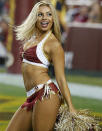 A Washington Redskins cheerleader performs during the first half of an NFL football preseason game against the New England Patriots.